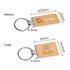 A wooden rectangle keyring with a metallic keyring attachment, featuring a logo and natural wood finish.