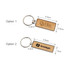 A wooden keyring with a rectangle design, featuring two branding options and a silver metal keyring.
