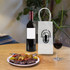 A PVC clear wine ice tote bag next to a red wine bottle and a plate of assorted food, with a glass of wine on the table.