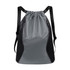 A grey and black sports drawstring backpack with mesh sides and a zippered pocket. It has adjustable straps.