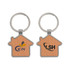 A wooden keyring shaped like a house, featuring a metallic keyring and logos on both sides.