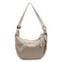 A beige crossbody bag with a woven zipper pull and an adjustable strap. It has a brand logo visible on the side.