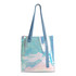 A clear PVC tote bag in iridescent colours with blue handles, featuring a logo on the front.