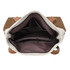 An interior view of a convertible canvas backpack to tote bag, featuring light fabric with dark brown compartments and leather straps.