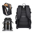 A black travel backpack with multiple compartments, padded straps, and a logo. Features a sleek design for easy transport.