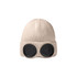 A beige beanie with black goggles attached at the front, featuring a ribbed texture. It has a logo displayed.