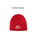 A red cable knit beanie featuring an embroidered mountain logo.