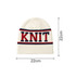 A knitted beanie in cream with red and navy stripes, featuring the word "Knit" across the front.