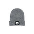A grey beanie featuring a built-in headlamp, with a circular light panel on the front. It has a logo on the side.