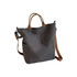A grey vintage style canvas bag with brown straps and two side pockets, featuring a small logo.
