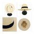 A Panama beach sun hat in light beige with a black band, displayed from multiple angles on a stand.