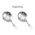 Two stainless steel cocktail strainers with a shiny finish and perforated design, featuring a handle for easy use.