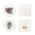 Four round paper coasters featuring various designs, including illustrations and logos, in cream and white tones.