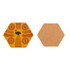 A hexagon ceramic coaster featuring a yellow design with Aboriginal art and a cork backing.