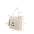 A cream casual canvas bag with two handles, a front pocket, and a small detachable pouch featuring a logo.