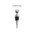 A drink bottle stopper featuring a chrome ball and a black rubber grip, with a pointed metal base. It includes a logo.