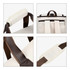 A cream and brown convertible backpack duffel garment bag, featuring padded handles and adjustable straps.