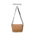 A tan polyurethane shoulder bag with a black strap, featuring a flap closure and a logo.
