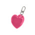 A heart-shaped reflective keychain in vibrant pink with a metal clip attachment.