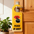 A custom shape acrylic door hanger in yellow with a design featuring a hand and lips, displaying the message "Please Be Quiet".