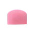 A pink flexible bowl scraper with a textured surface and a rounded top, featuring a logo.