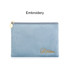 A durable flat makeup bag in soft blue with a gold embroidered logo and a zip closure.