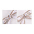 A set of two twist tie bows featuring a white and brown checkered design with branding.