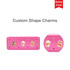 A pink silicone pencil case featuring heart-shaped holes and animal-shaped charms, with a logo on the side.