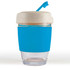 A reusable coffee cup in clear glass with a blue silicone band and a lid, featuring a straw.