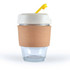 A reusable coffee cup featuring a clear glass body with a cork band and a light-colored lid topped with a yellow straw.