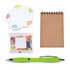 A colorful notepad in the shape of a flower, a small bag of jelly beans, a blank notepad, and a green pen.