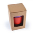 A red reusable coffee cup in a cardboard box, featuring a window to view the cup inside.