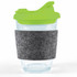 A reusable coffee cup with a transparent body, green snap lid, and a gray RPET band for grip.