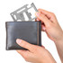 A multi-tool card is being held above a black wallet, showcasing its compact design and versatility.