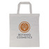 A beige tote bag with short handles and a logo in the center.