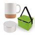 A coffee mug with a cork base, a small round speaker, and a green insulated carrying bag.