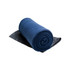 A rolled Polar Blanket in a deep blue color, positioned on a dark gray surface.