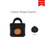 A black mini bag charm featuring a pumpkin design, with a logo. Measures 6mm and has holes for attachment.