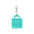 A turquoise mini bag keychain featuring holes and a clip for attachment. It has a simple and playful design.