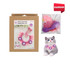 A crochet kit for pets featuring pink, purple, and white yarn with a boxed pattern design and an accompanying cat model.