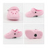 Four pink clog shoe-shaped charms displayed from different angles, featuring ventilation holes and a strap.
