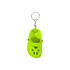 A bright yellow paw-shaped clog shoe keyring with a metal keychain attachment.