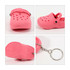 A pink classic clog shoe keyring with ventilation holes and a keychain loop, featuring a textured sole.