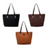Three suede leather tote bags in black, brown, and tan with long handles and a logo on each.