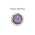 A round, foldable desk hook in gold with a purple center featuring a logo.