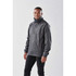 A dark grey men's anorak jacket with a high collar, featuring a logo, displayed on a model against a neutral background.