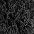 A close-up of shredded filler in various shades of black, creating a textured appearance.