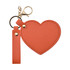A heart-shaped compact mirror in orange, featuring a keychain attachment and a clasp for easy carry.