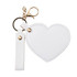 A heart-shaped compact mirror in white with a keychain and a gold-coloured clasp. It features a simple design.