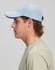 A light blue Jacquard Texture 5 Panel Cap shown on a model's head, featuring a branding logo on the side.